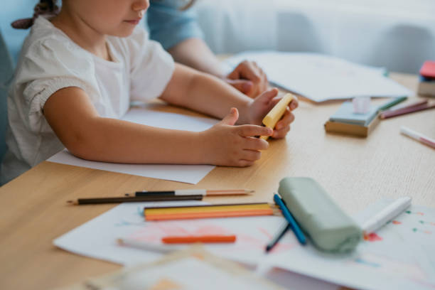 istock Anonymous Girl Drawing and Using her Smartphone for Inspiration 1291476349