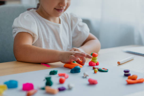 istock Unrecognizable Girl Playing with Plasticine 1291476360
