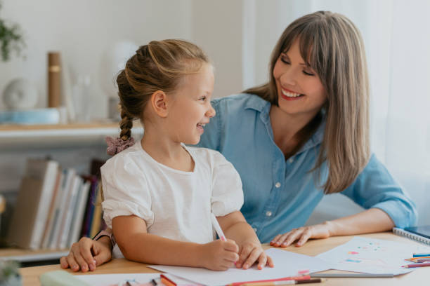 istock Happy Mother and Daughter Spending Quality Time Drawing 1291476419