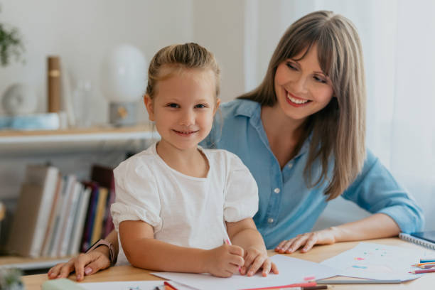 istock Happy Mother and Daughter Spending Quality Time Drawing 1291476437