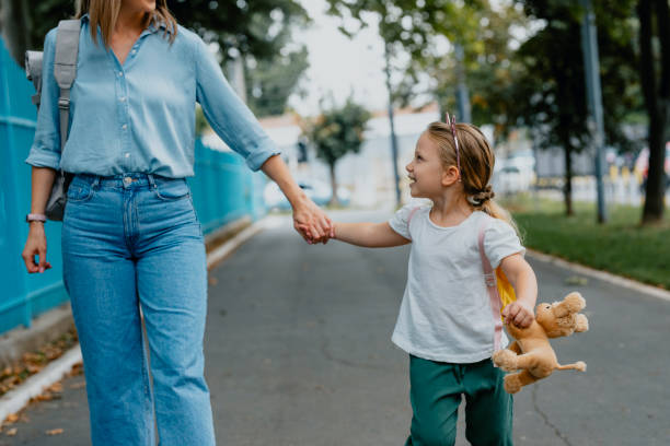 istock Mother Taking her Daughter to School 1291476446
