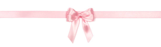 istock Pink ribbon with bow isolated on white background. 1291480421