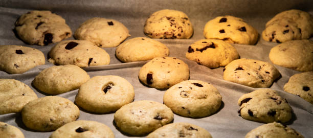 istock Chocolate chip cookies lined on a tray in the oven 1291483469