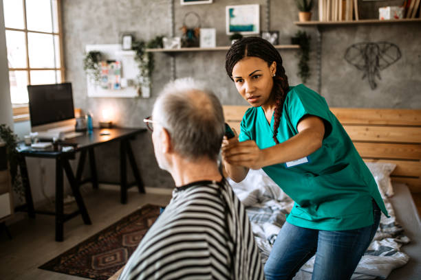 istock Nursing home haircut service 1291484002