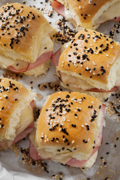 istock Baked Ham And Swiss Sliders on White Dinner Buns 1291485647