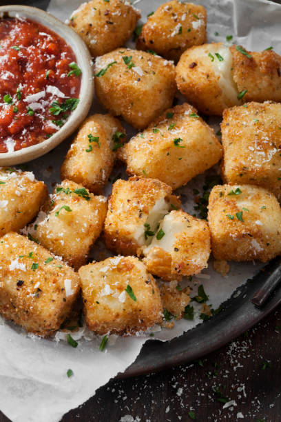 fried halloumi cheese nuggets with marinara dipping sauce - mozzarella stick appetizer fried imagens e fotografias de stock