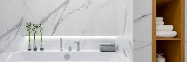 istock Bathtub in bathroom with marble tiles, panorama 1291487146