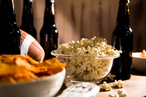 istock Watching the football game with snacks, drinks. 1291487734