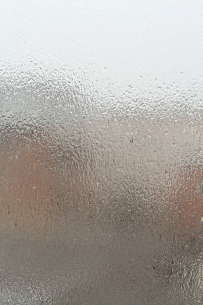 istock Street view through an ice-covered window outside. Dull cloudy winter day. 1291493396
