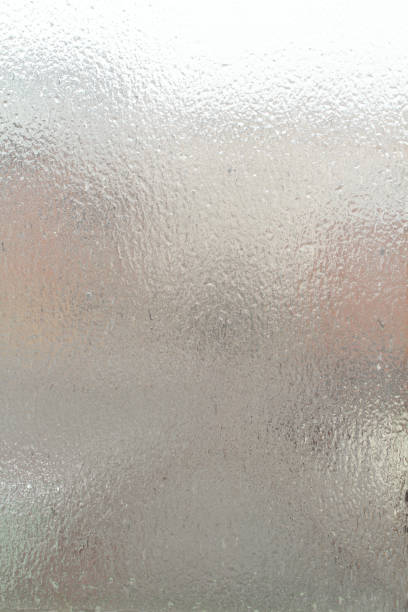 istock Street view through an ice-covered window outside. Dull cloudy winter day. 1291493401