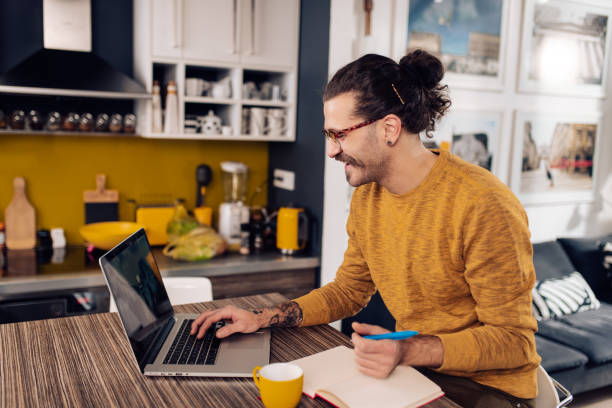 istock Young entrepreneur planning his business at home 1291494957