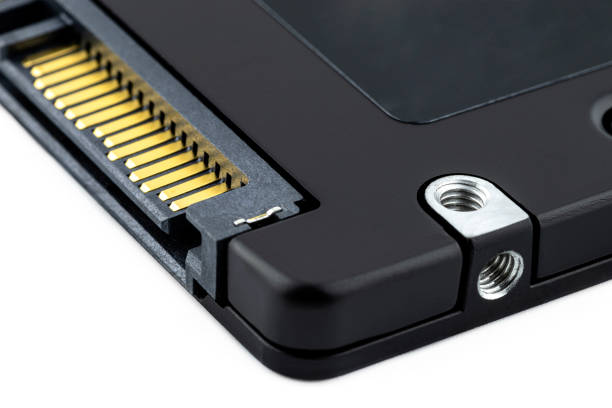 istock Macro shots of the SATA connector and the power connector on the solid-state drive, visible screw fixing. 1291495330