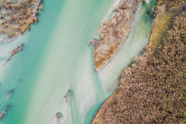 istock Aerial view of river next to bush. 1291499817
