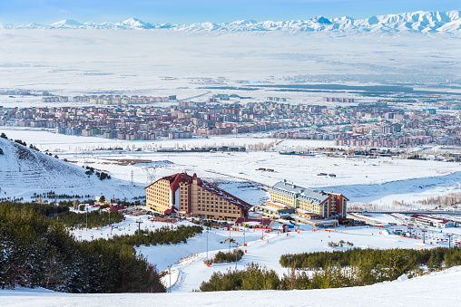 View of the snowy Palandoken mountains and Erzurum city in winter.