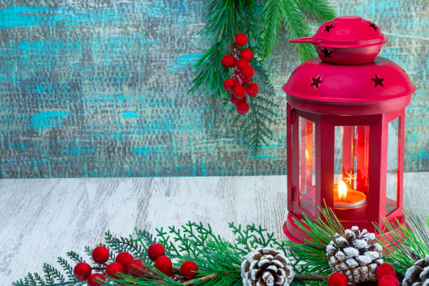 istock Decorative red New Year's lantern with a burning candle in a Christmas composition. 1291502859