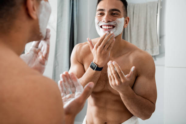 istock Smiling young man in shaving foam on face 1291504606