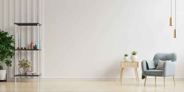 istock Colorful interior with a pink armchair on empty white wall background. 1291504820