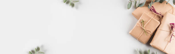 istock Gift boxes wrapped in craft paper with dried flowers 1291506600
