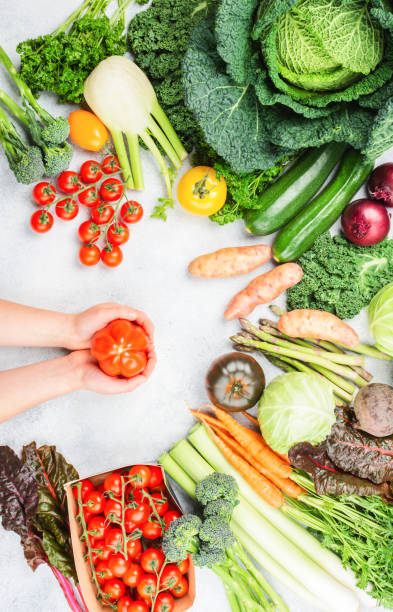 istock Variety of organic vegetables on blue table 1291506725