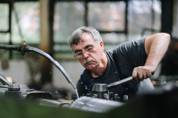 istock Senior technician working in the factory 1291507178