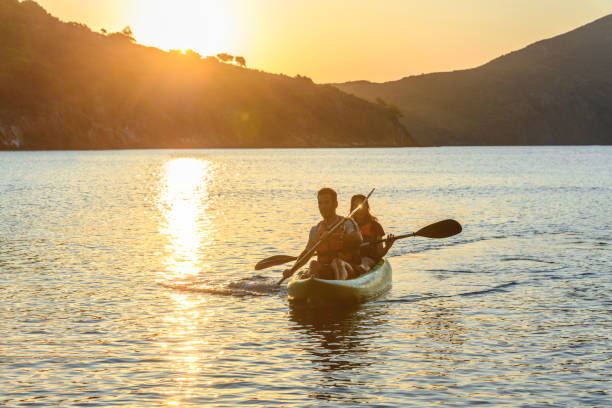 istock Spanish Couple Kayaking Off the Costa Brava at Dawn 1291507933