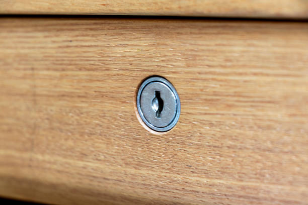 istock Wooden drawer with keyhole 1291513979