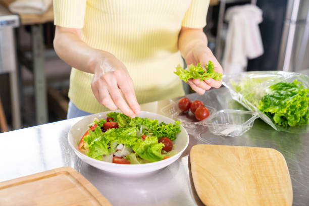 istock asian woman cooks in a kitchen,hands 1291514910