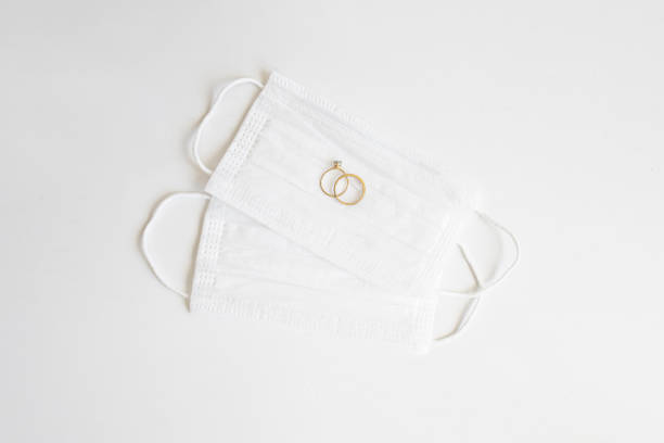 istock Protective face masks with wedding rings 1291517272