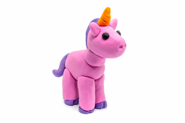 istock Play dough unicorn on white background. Handmade clay plasticine 1291527685