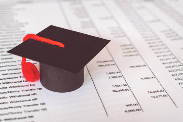 istock Graduation hat on statement. Statement for education Finance Loan 1291529304