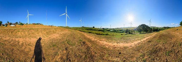 Panorama wind turbines park for make the electric power from wind in sunset time