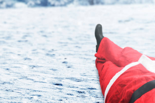 istock Santa Claus lying on the snowfield 1291534587