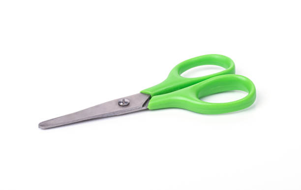 istock sharp office green paper scissors isolated on a white background. school supplies 1291538975