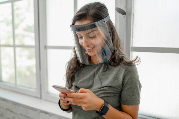 istock women wear face shield to protect themselves 1291540361