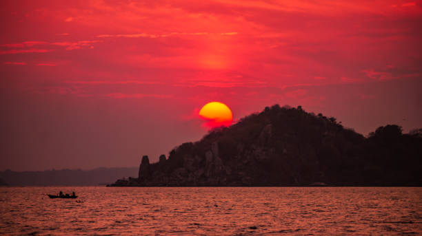 Sunset over Saanane Island Sunset over Lake Victoria lake victoria stock pictures, royalty-free photos & images