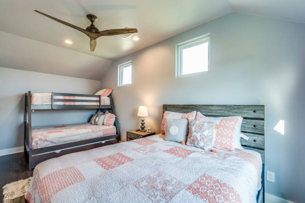 istock Bedroom with high ceiling and bunk beds 1291541169