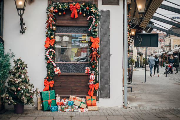 Christmas decorations on the street on cafe windows outdoors in city.