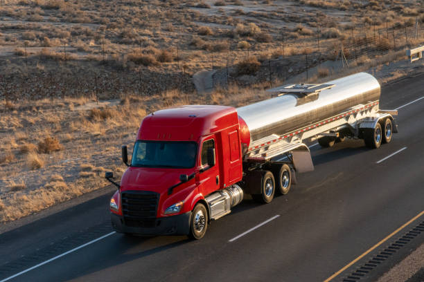 istock Long Haul Semi Trucks on A Two Way Highway 1291541656