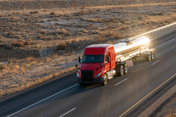istock Long Haul Semi Trucks on A Two Way Highway 1291542251