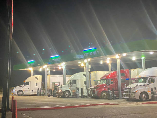 istock Long Haul Semi Trucks on A Two Way Highway 1291542300