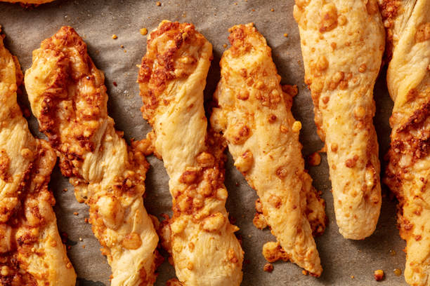 istock Homemade cheese straws on a baking tray 1291542611