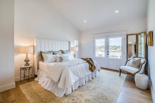 istock White furniture with lovely headboard and white bedding 1291546834