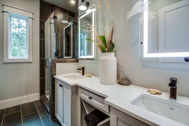istock LED lighted mirrors in newly designed bathroom 1291546843