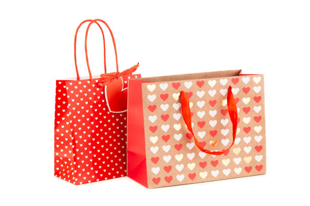 istock Two shopping bags with hearts pattern 1291546860