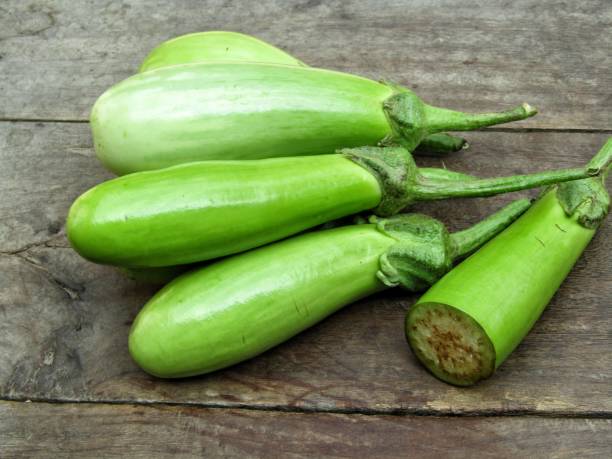 istock Fresh Eggplant or brinjal on old wooden background 1291548101