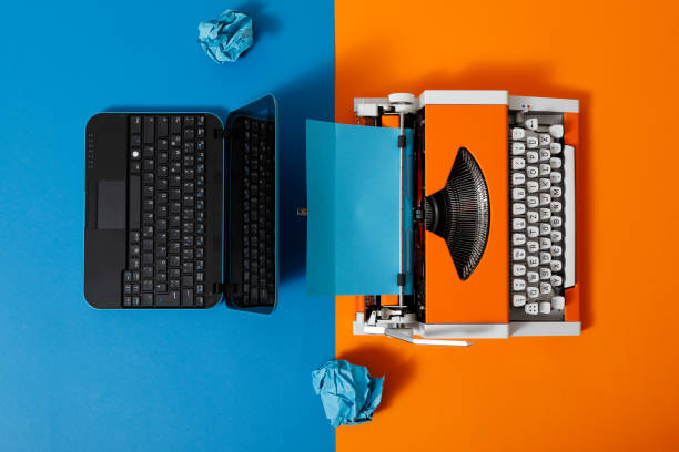 Digital and analog – Laptop and 70s Typewriter