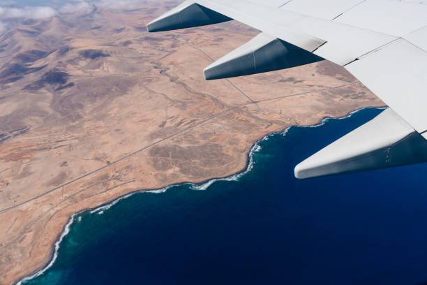 istock Aerial View Through Window Of Plane 1291550110