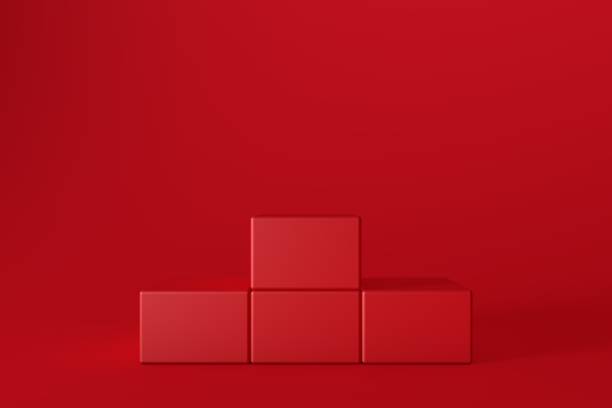 istock 3D Red Cube Stands On Red Background, Product Stand, Blank Scene 1291550126