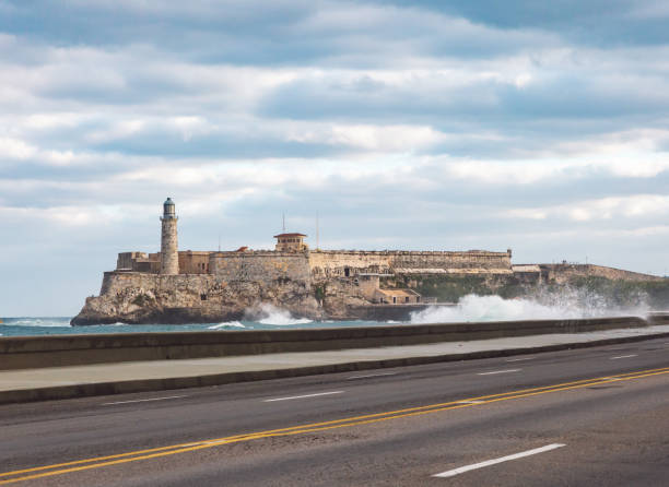 istock Road By Sea Against Cloudy Sky 1291551588