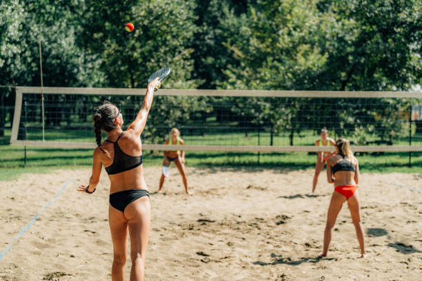 istock Beach Tennis Player Serving The Ball 1291551856
